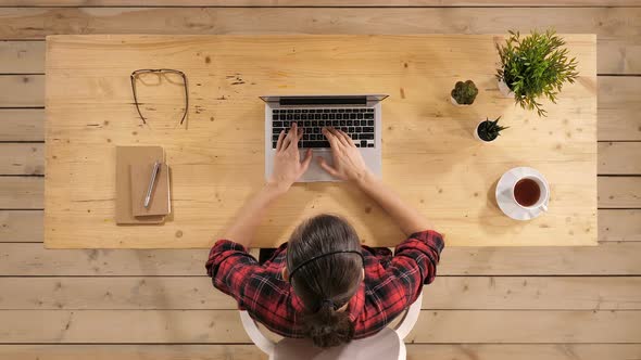 Multitasking Woman Working on Laptop