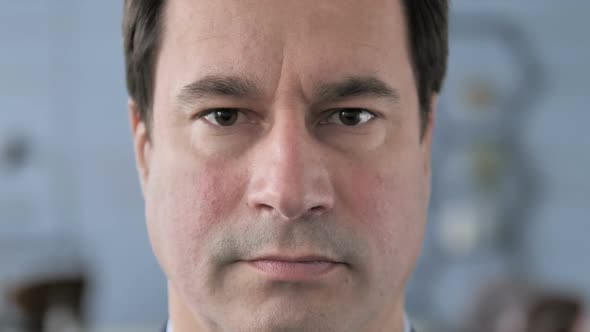 Close Up of Serious Middle Aged Man Face