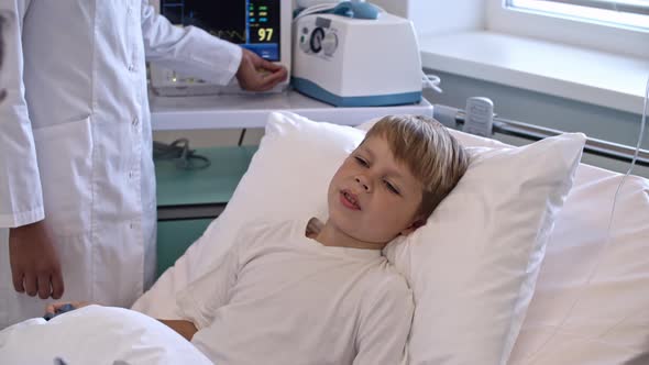 Boy Talking to Doctor during Medical Exam