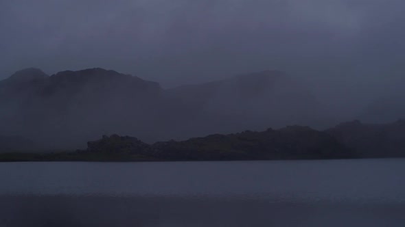 dramatic iceland landscape at night, mountain lake,  camera movement, camera pan from left to right