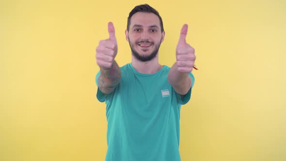 Happy Young Sporty Man Giving Thumbs Up