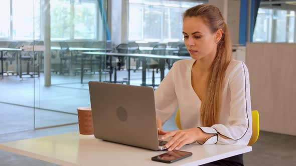 Businesswoman Drinking Coffee Use Computer Indoor