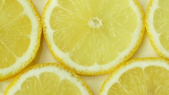 Rotation of a juicy yellow lemon. Top view, 360 degree rotation, close-up of a lemon in a cut.