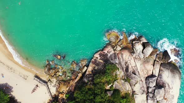 Abstract tropical coast background. Sandy beach, rocks, jungle, turquoise sea. Paradise island perfe