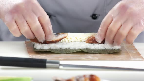 Hands Making Unagi Sushi