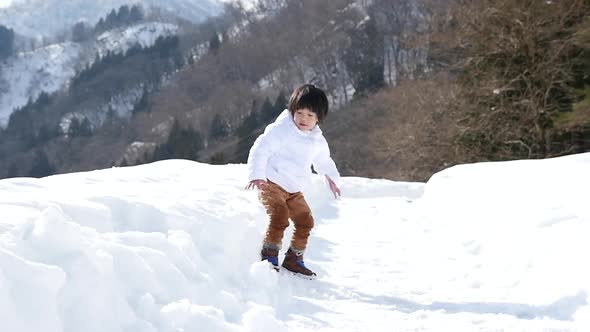 Cute Asian Child Playing Snow Outdoors Slow Motion