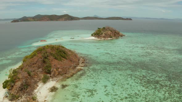 Small Torpic Island with a White Sandy Beach Top View