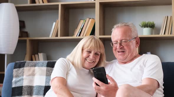 Happy Family of Senior Couple Having Fun Taking Selfie Photo Together on Smartphone