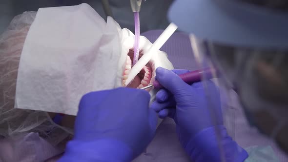 Dentist Conducts Dental Hygiene To the Patient