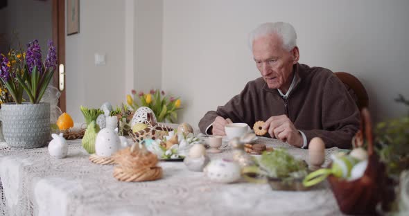 Man Having Breakfast At Home During Easter