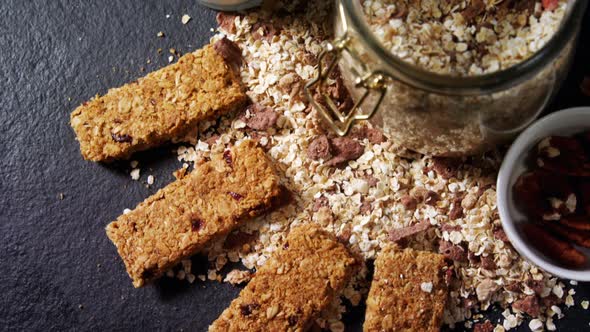 Granola bars with jar of muesli and milk 4k