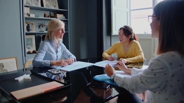 Three businesswomen having a meeting in the office