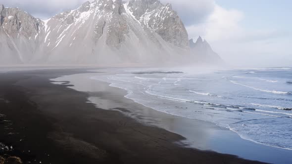 Drone Above Tide And Beach With View Of Misty Vestrahorn