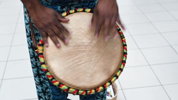 African American Man Plays the Hand Drum