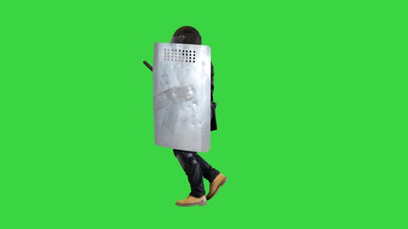 Riot Policeman Running with a Shield and Baton on a Green Screen Chroma Key