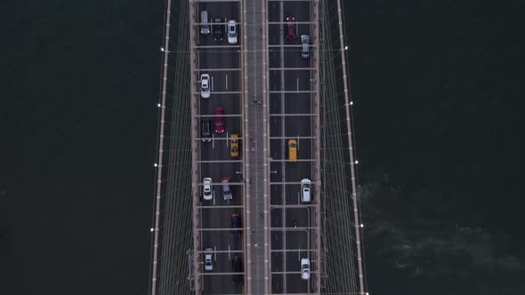 Aerial view on top of cars driving on the Brooklyn bridge, in New York, USA - birds eye, drone shot