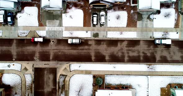 Snowy rooftops are lined up like soldiers in this 4k drone shot following a late March storm.