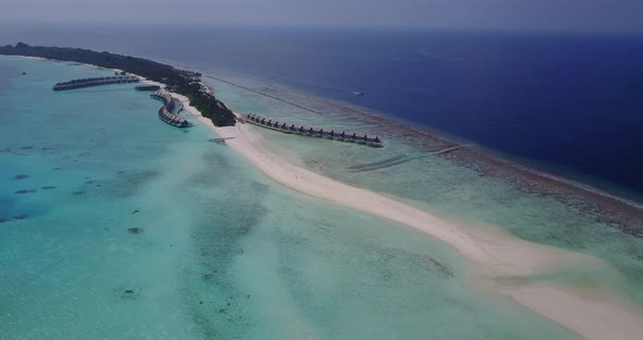 Beautiful birds eye island view of a white sandy paradise beach and blue sea background