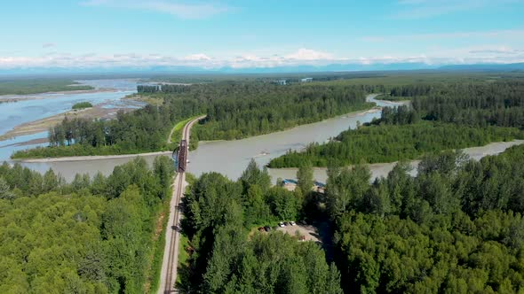 4K Drone Video of Alaska Railroad Train Trestle with Mt. Denali in Distance during Summer
