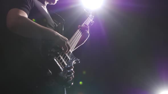 Musician Plays Music. Grif Guitar with Strings. Bottom View