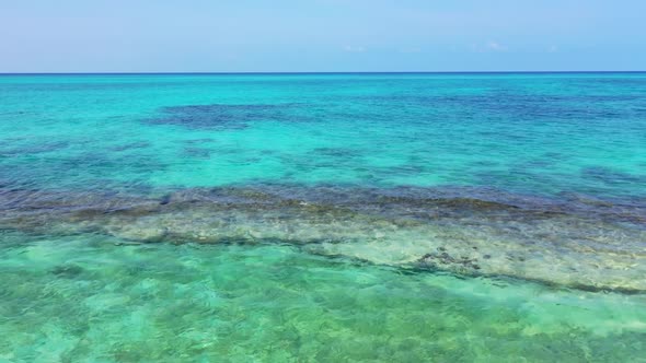 Aerial flying over nature of perfect lagoon beach adventure by aqua blue ocean with white sandy back