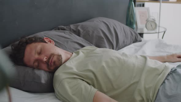 Man Falling on Bed and Sleeping