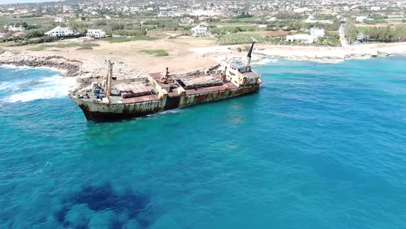 Flying Over Coastline with Broken Ship