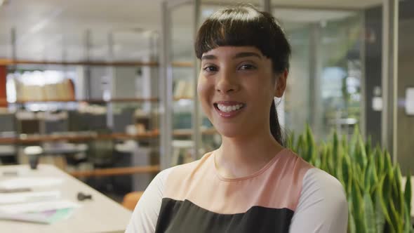 Portrait of happy caucasian businesswoman in empty office