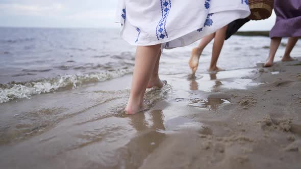 Barefoot Feet of Slim Young Women in Traditional Ukrainian Embroidered Dresses Walking in Slow