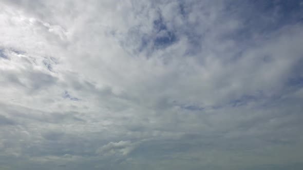 Time lapse of white cloud moving pass around sky background