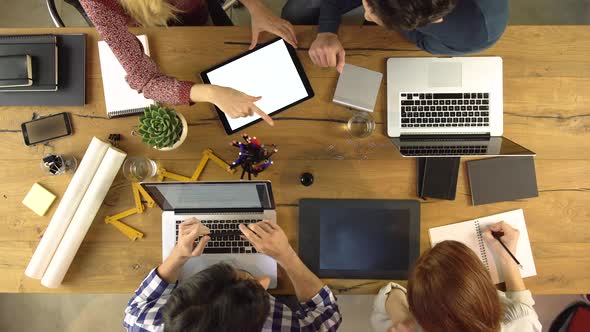 Top Overhead View People Group Using Tablet on a Design Project Idea