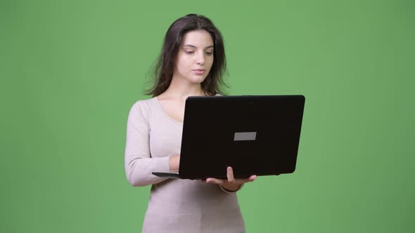 Young Beautiful Woman Using Laptop