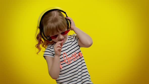 Cheerful Cute Blonde Child Kid Listening Music Via Headphones Dancing Disco Fooling Having Fun Party