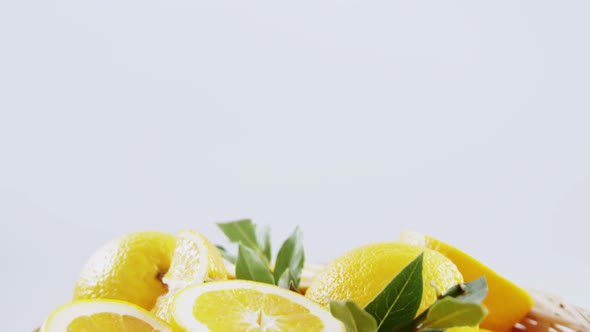 Close-up of sweet limes in wicker basket