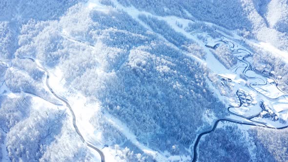 Aerial Drone  View Of  Winter Forest And Highway  In  Mountains 