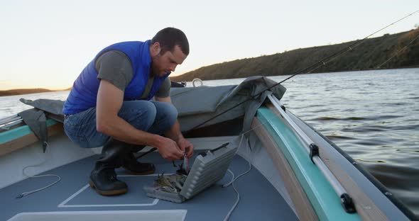 Man preparing bait for fishing 