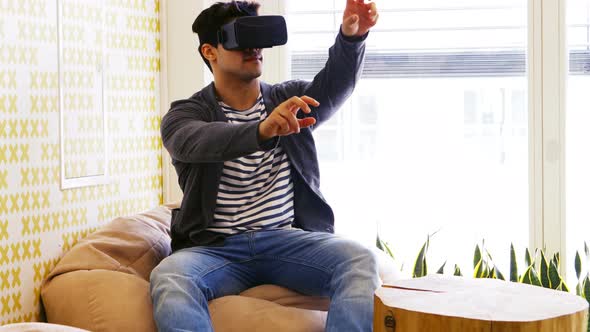 Business executive using virtual reality headset