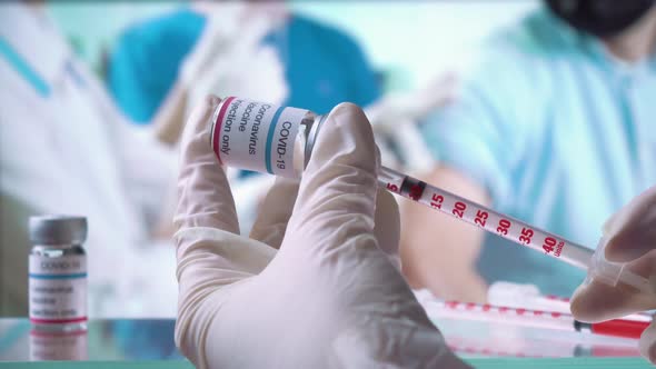 A Nurse is Injecting a Vaccine to a Patient in the Clinic