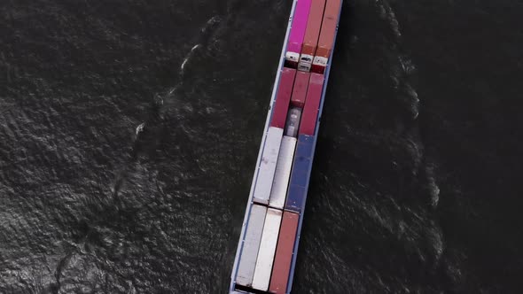 dutch container vessel sailing on a river