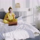 Positive Lady in Pajamas with Mask Dancing on Bed - VideoHive Item for Sale