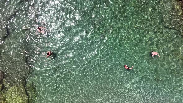 People swim in the azure sea aerial view 4 K