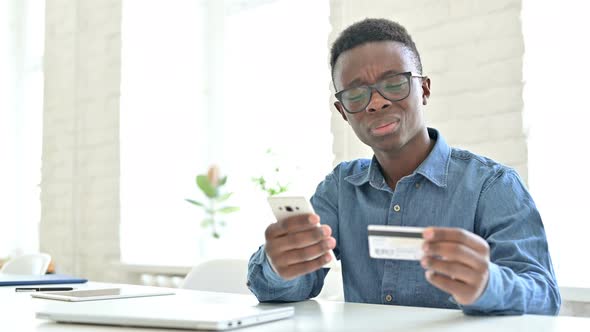 Online Payment Failure on Phone by Young African Man 