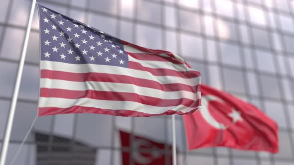 Flags of the United States and Turkey in Front of a Skyscraper