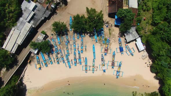 Jukung, wooden fishing boats on sand aerial close up, Gesing Beach, Yogyakarta