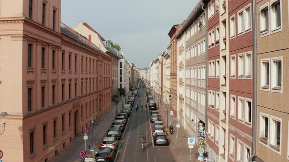 Forwards Tracking Shot of Cyclists Riding Through Linienstrasse Street Changed to Cycle Route