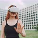 A woman experimenting augmented reality goggles in the city - VideoHive Item for Sale