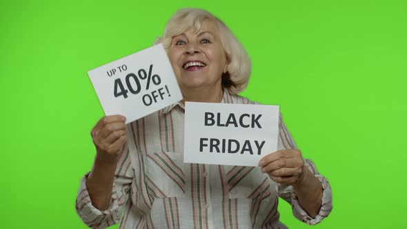 Senior Grandmother Showing Black Friday, 40 Percent Off Discount Advertisement Inscriptions