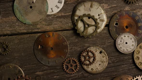 Rotating stock footage shot of antique and weathered watch faces 