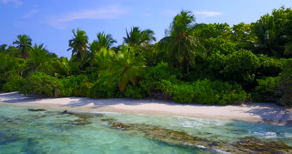 Tropical flying abstract shot of a summer white paradise sand beach and blue sea background in high 