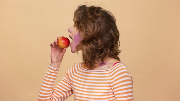 Portrait of Happy Woman 20s Wearing Casual Clothing Eating Red Juicy Apple and Enjoying Fresh Fruit